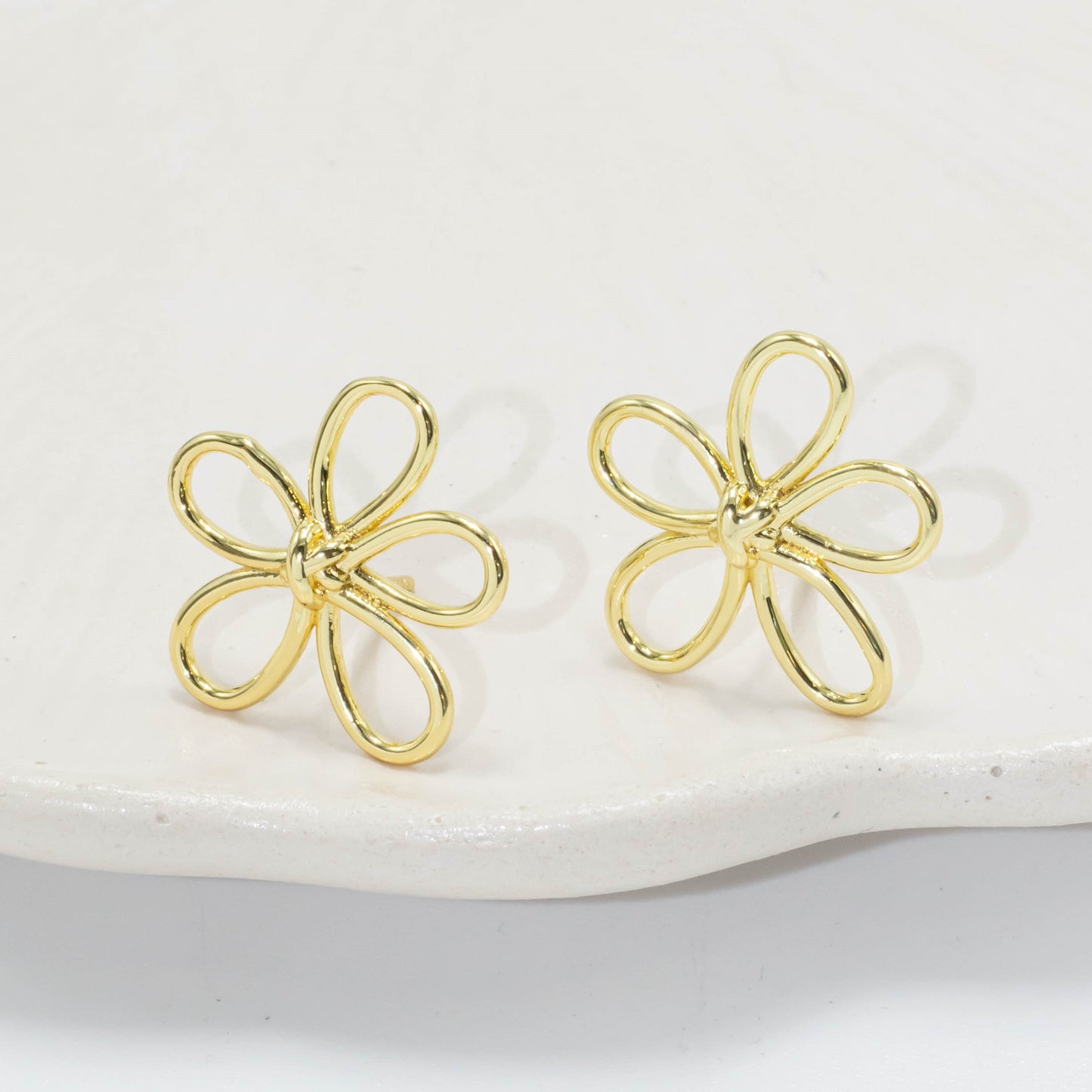 Arete flor silueta
