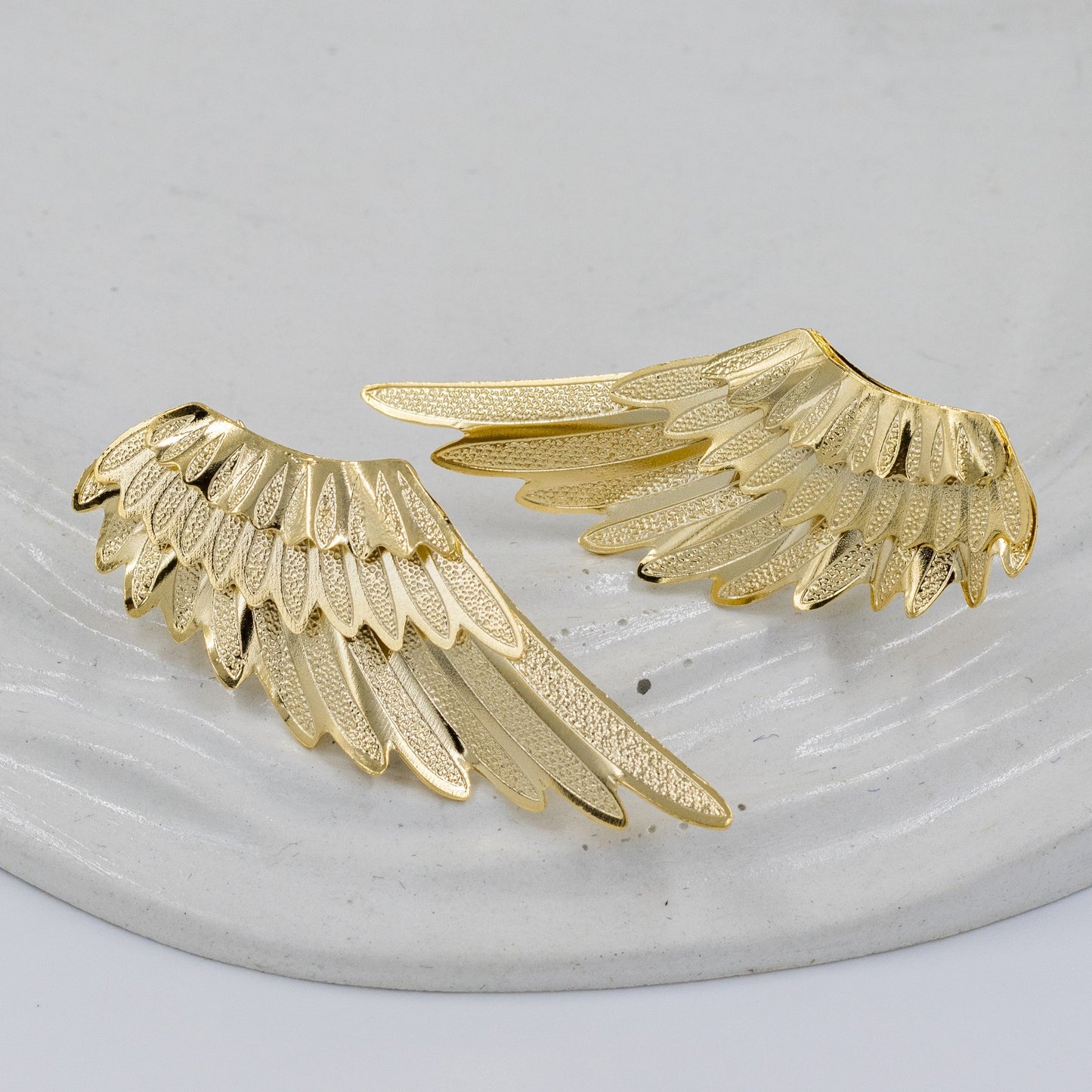 Arete bronce alas triples 4.5cm