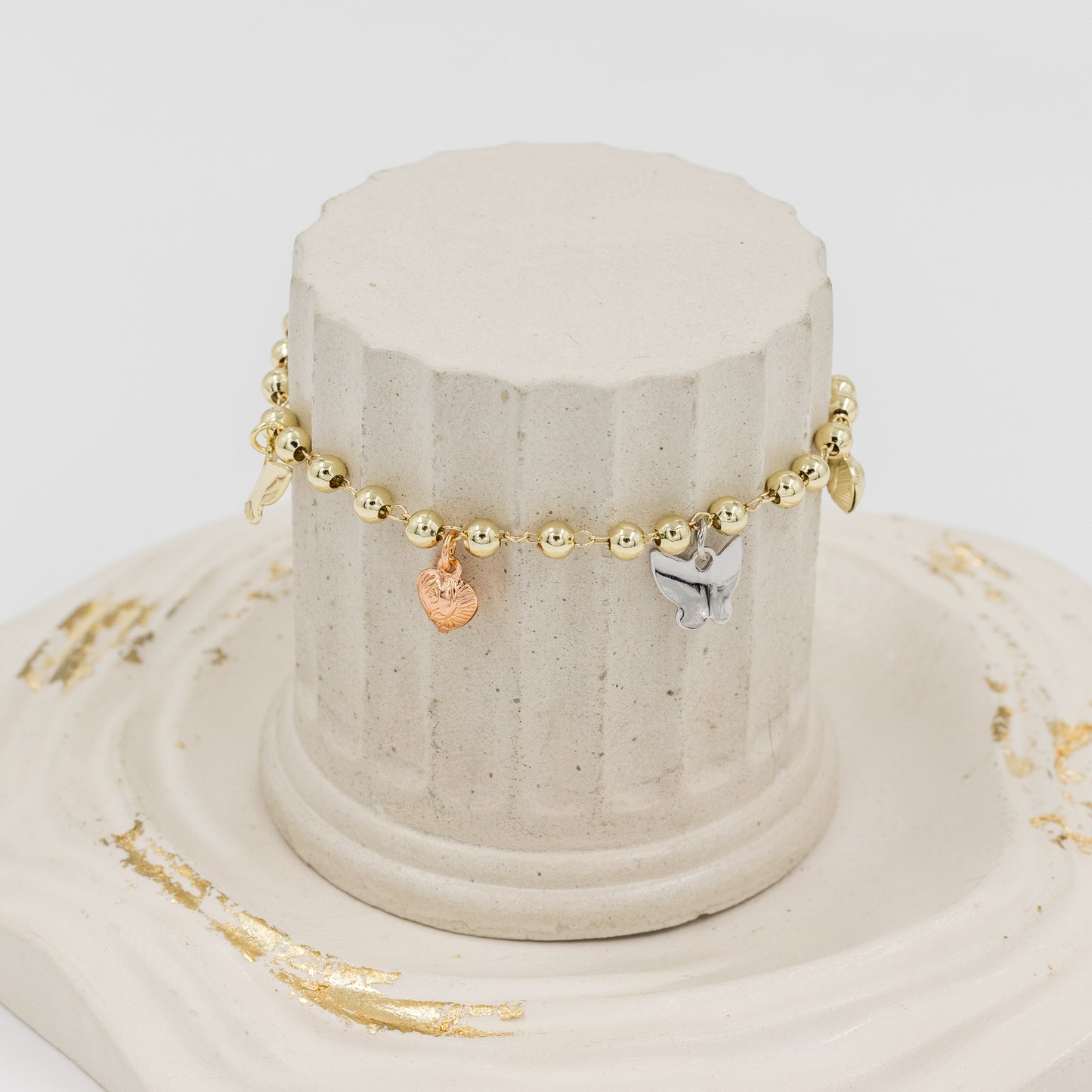 Pulsera mariposas tres oros