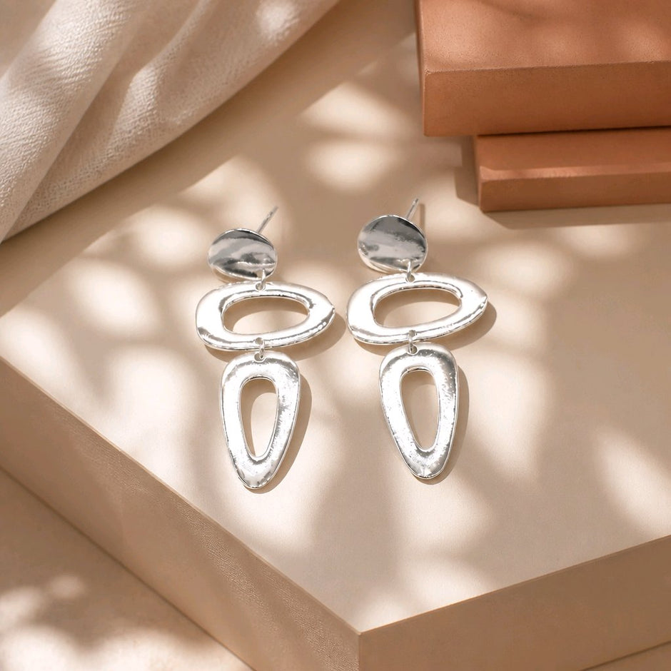 Arete figuras baño de plata