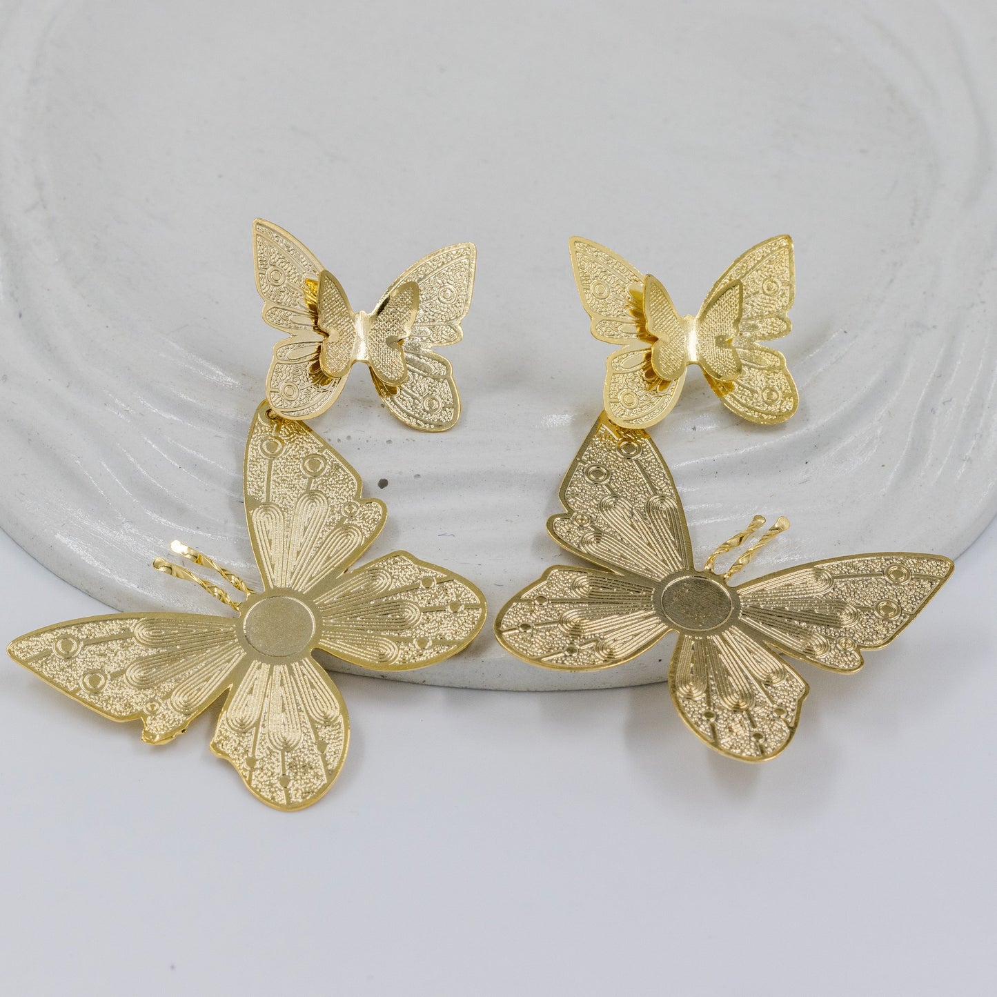 Arete bronce eslabones mariposas 7cm