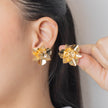Arete bronce flor