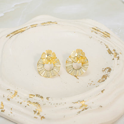 Arete bronce círculo flor