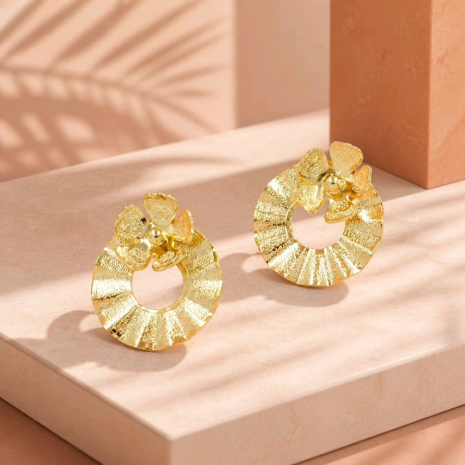 Arete bronce círculo flor