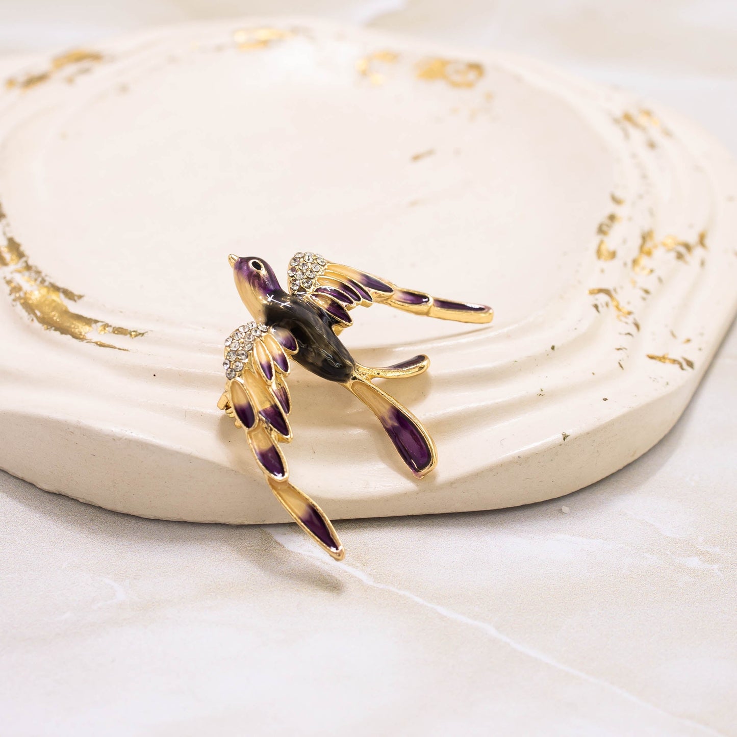 Broche golondrina