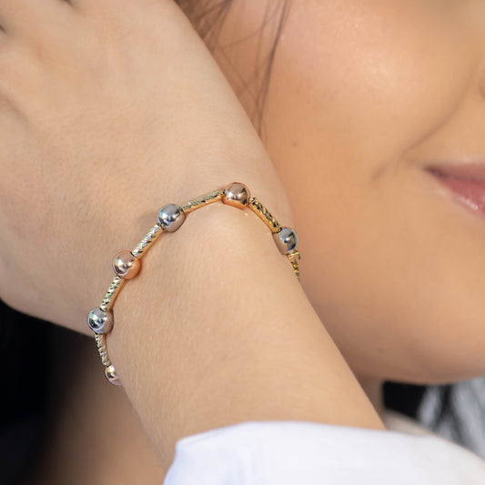 Pulsera balines dos oros