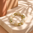 Pulsera resina corazones beige