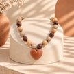 Collar rodio café corazón acre